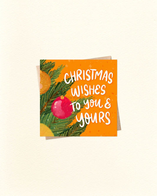 Square Christmas greeting card with festive message ‘Christmas Wishes to You and Yours’, displayed on a brown kraft envelope. Unique holiday card design, perfect to buy in Australia for friends and family.