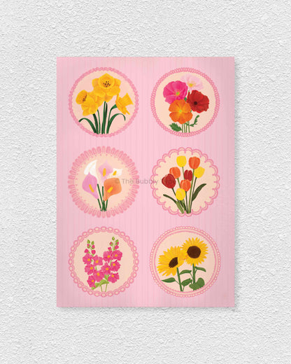 Art print of floral circle stamps with various flowers on a pink background